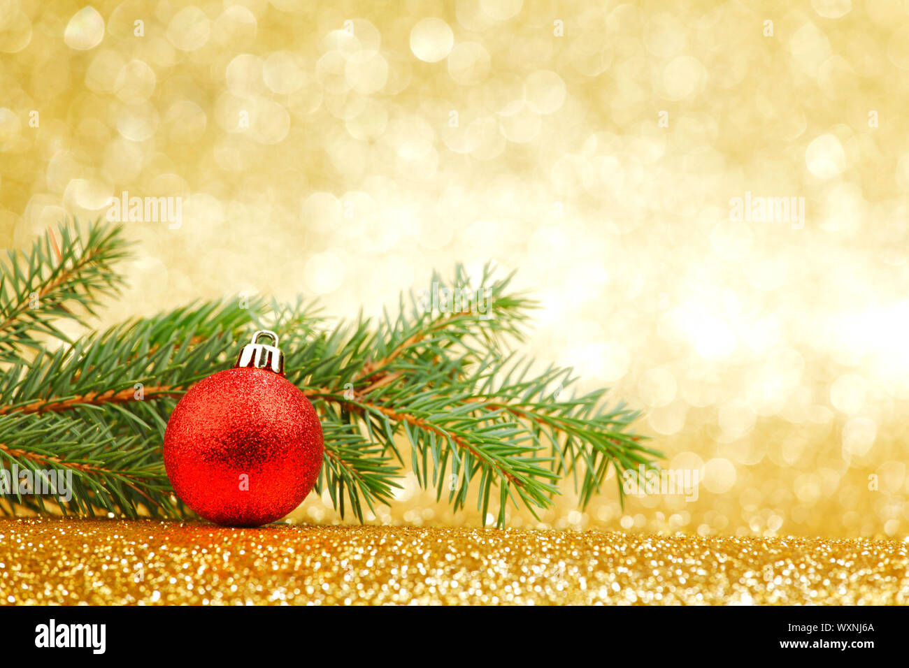 New year card with natural fir branch and ball Stock Photo - Alamy