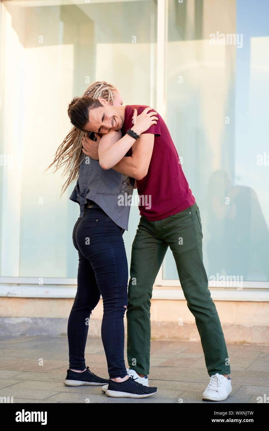 Young couple enjoying first date, dancing outdoors Stock Photo