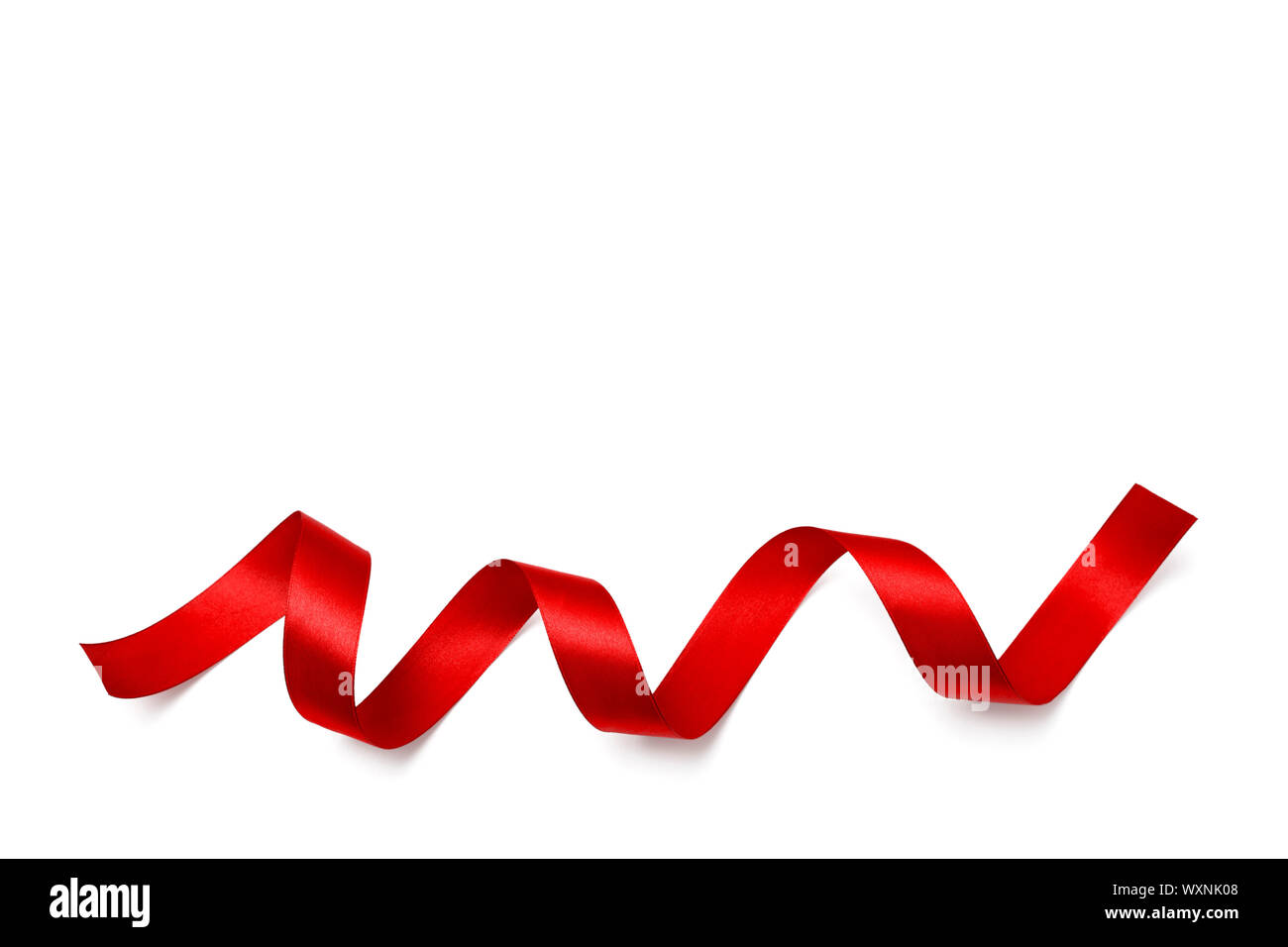 Shiny red satin ribbon on white background Stock Photo - Alamy