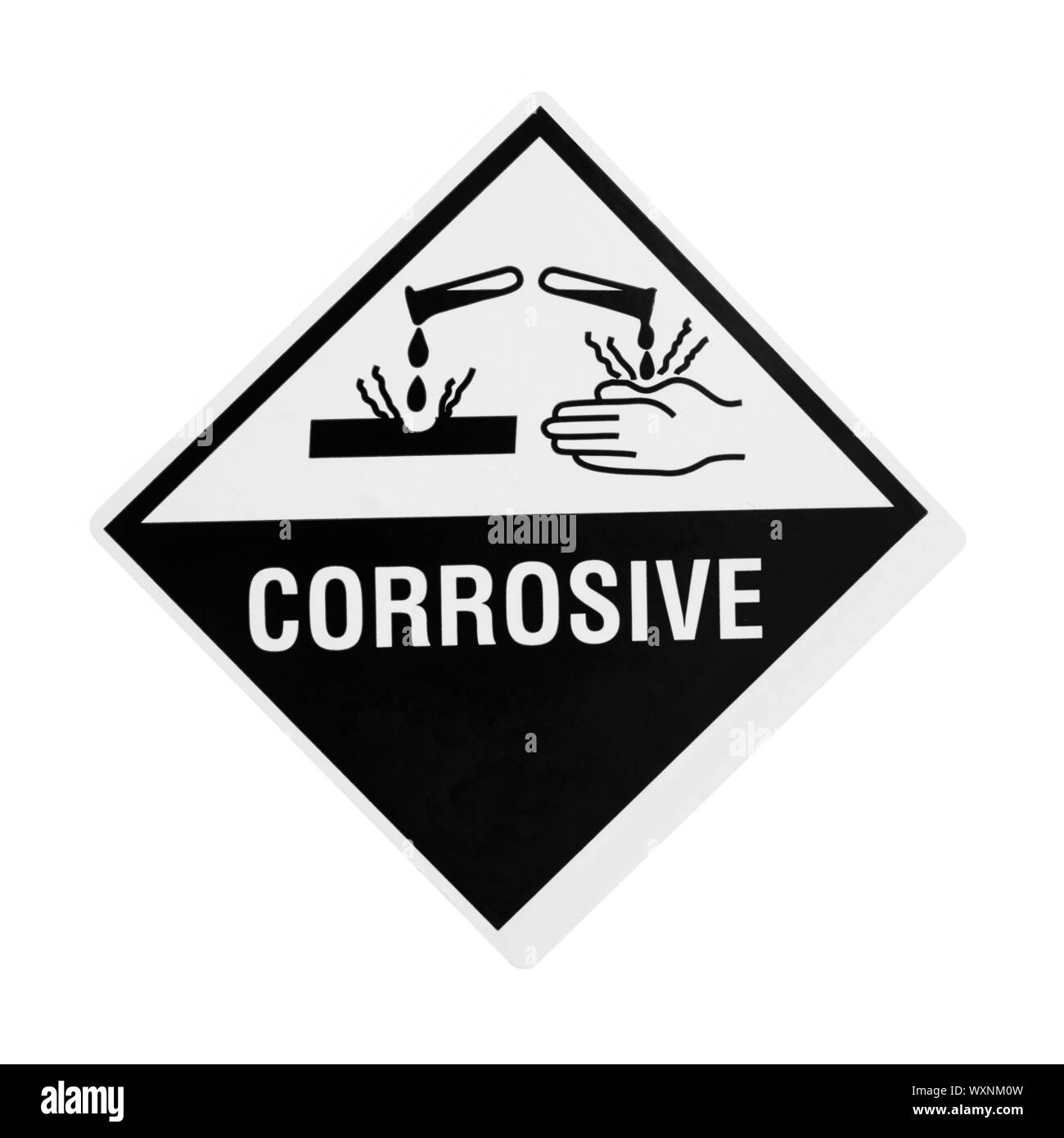 A black and white corrosive warning sign over with clipping path Stock Photo