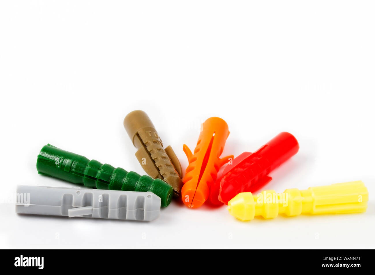 six colored rawl plugs on white background Stock Photo Alamy