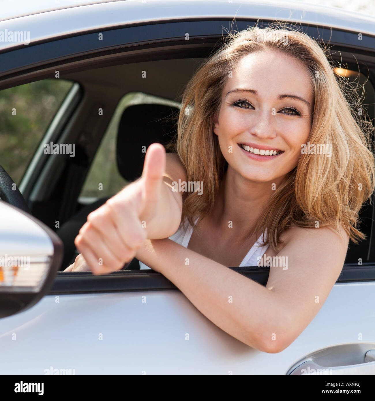 young attractive happy woman sitting in car summer portrait outdoor ...