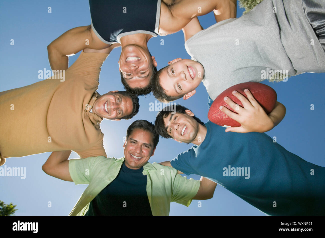Men in a Football Huddle Stock Photo Alamy