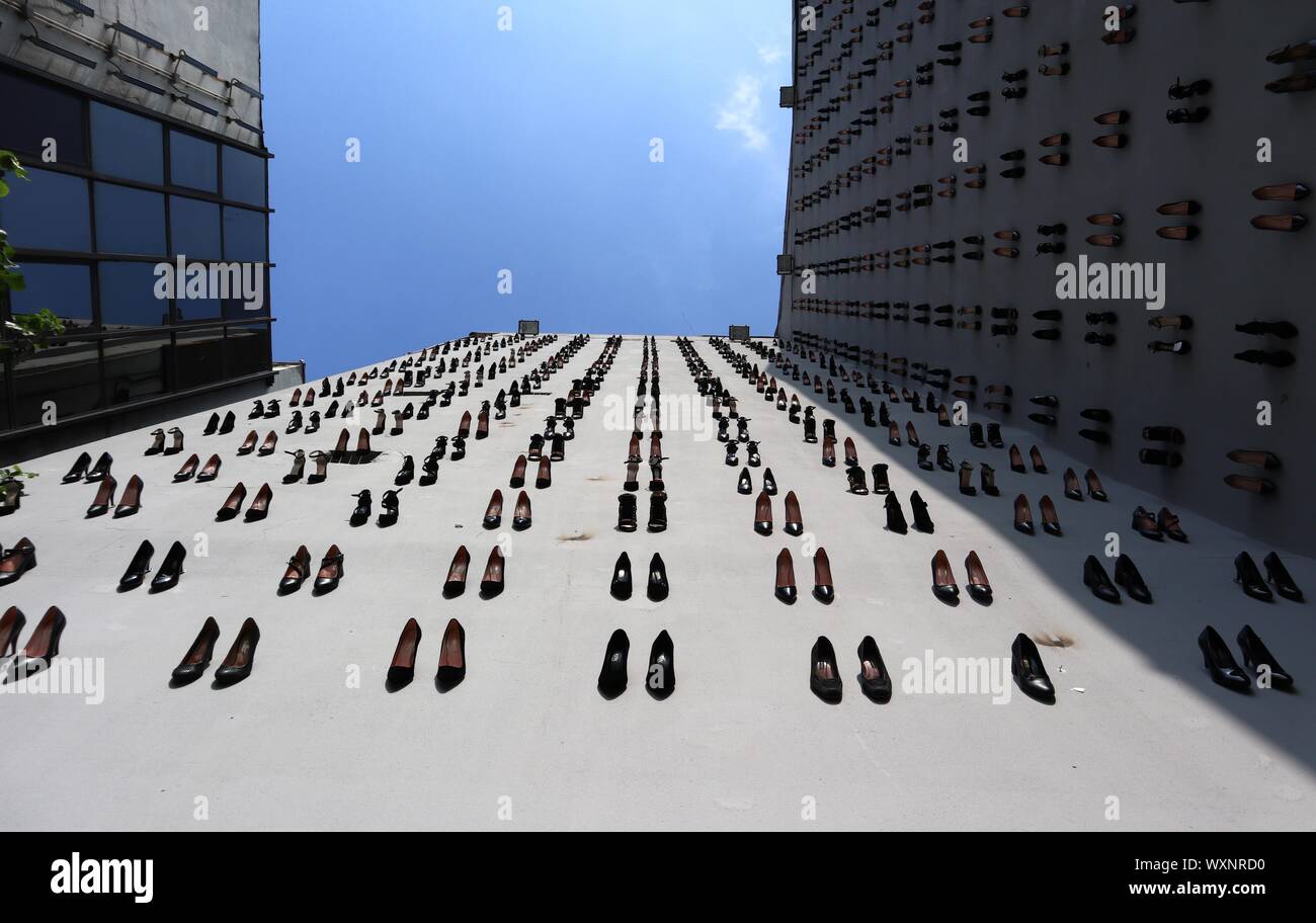 Istanbul, Turkey. 17th Sep, 2019. High heels are installed on a facade of a building in downtown Istanbul, Turkey, Sept. 17, 2019. A total of 440 pairs of high-heel black shoes were installed recently on a facade of a building in downtown Istanbul to draw attention to the equal number of women murders in Turkey last year and raise awareness against increasing male violence in the country. Credit: Xu Suhui/Xinhua/Alamy Live News Stock Photo