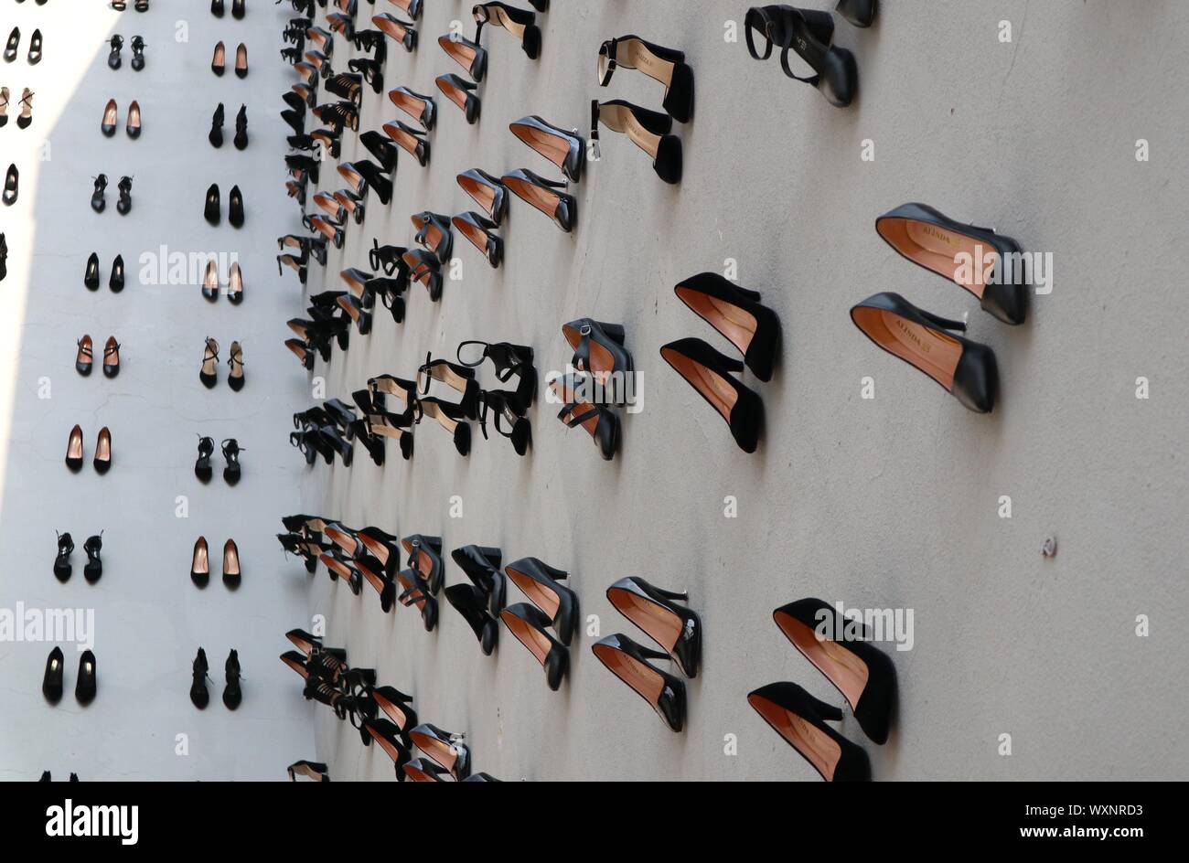 Istanbul, Turkey. 17th Sep, 2019. High heels are installed on a facade of a building in downtown Istanbul, Turkey, Sept. 17, 2019. A total of 440 pairs of high-heel black shoes were installed recently on a facade of a building in downtown Istanbul to draw attention to the equal number of women murders in Turkey last year and raise awareness against increasing male violence in the country. Credit: Xu Suhui/Xinhua/Alamy Live News Stock Photo