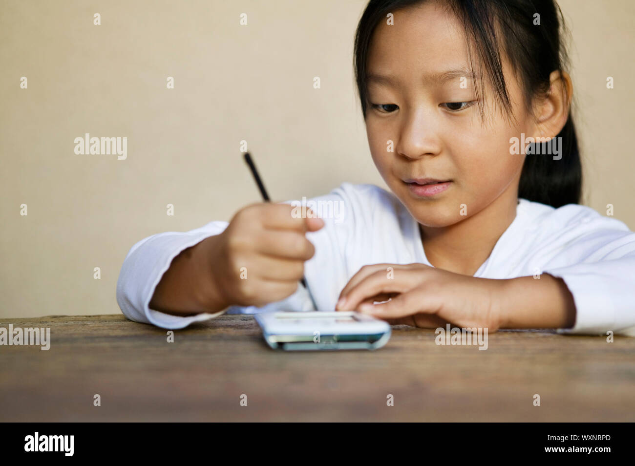 Girl using PDA Stock Photo Alamy