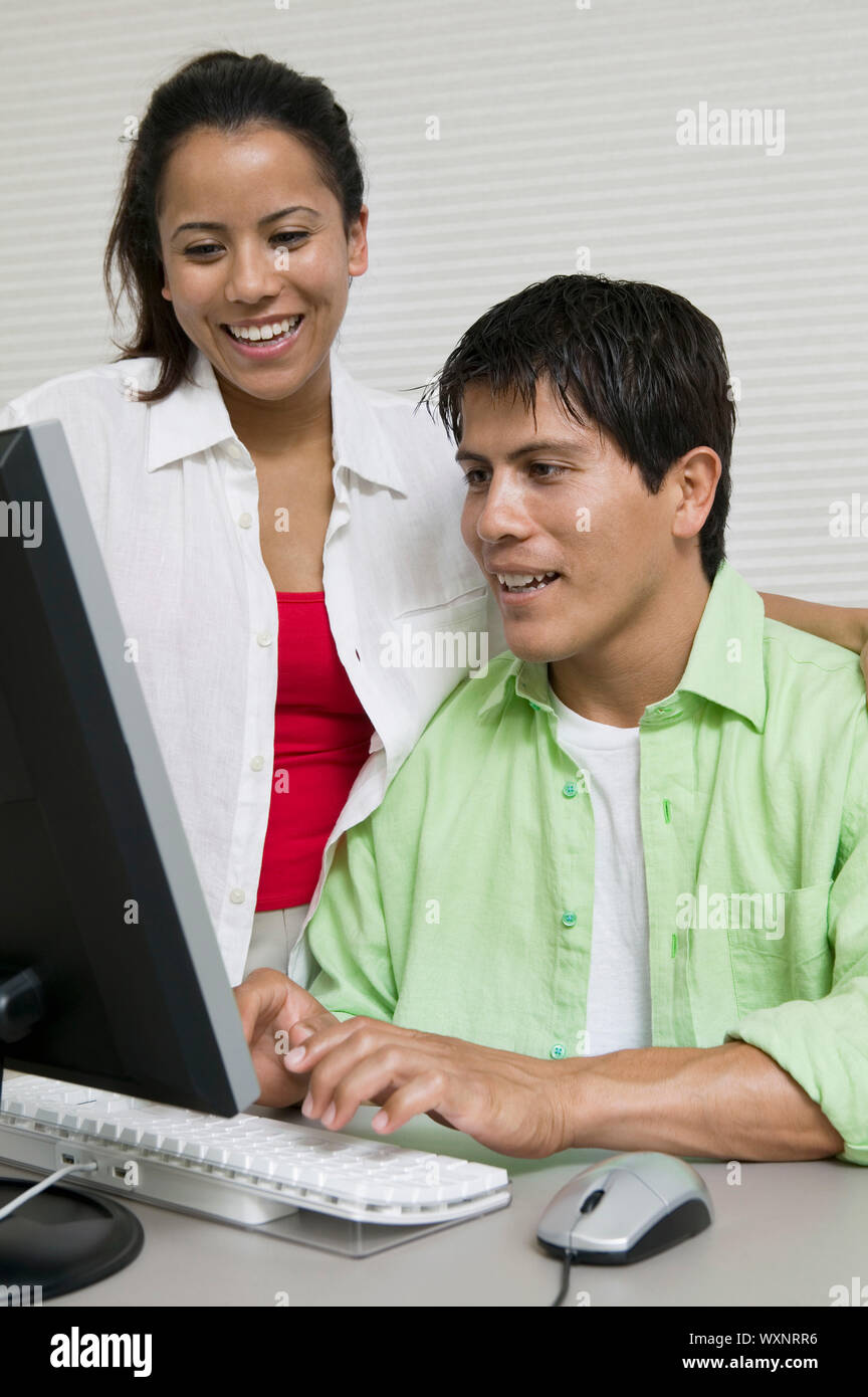 Using Computer With Partner Couple Using Computer Stock Photo - Alamy