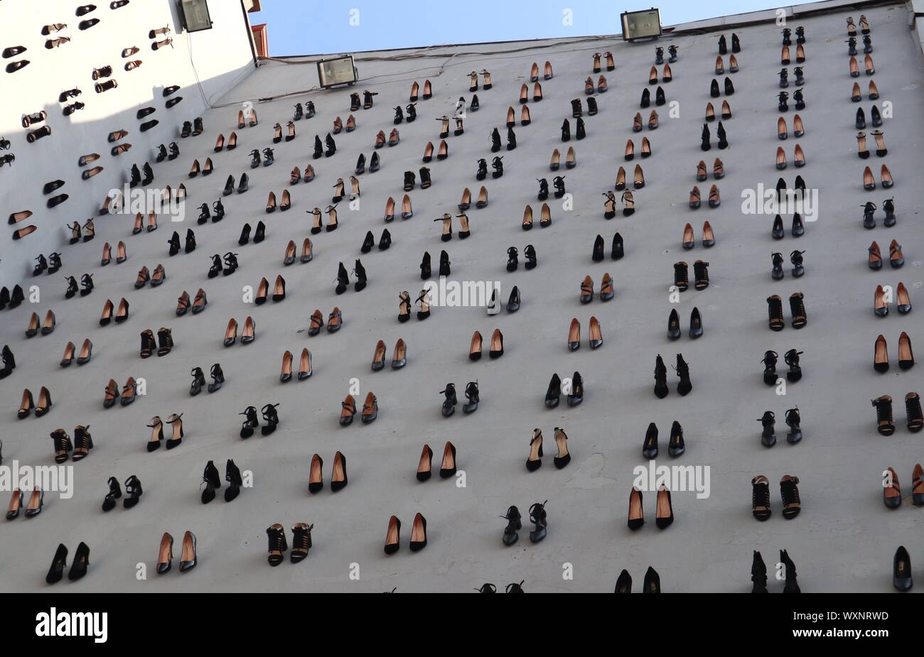 Istanbul, Turkey. 17th Sep, 2019. High heels are installed on a facade of a building in downtown Istanbul, Turkey, Sept. 17, 2019. A total of 440 pairs of high-heel black shoes were installed recently on a facade of a building in downtown Istanbul to draw attention to the equal number of women murders in Turkey last year and raise awareness against increasing male violence in the country. Credit: Xu Suhui/Xinhua/Alamy Live News Stock Photo