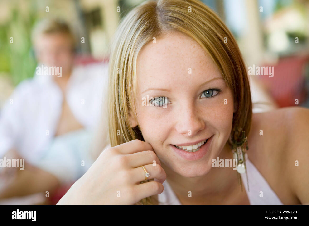 Teenage Girl Relaxing Poolside Stock Photo