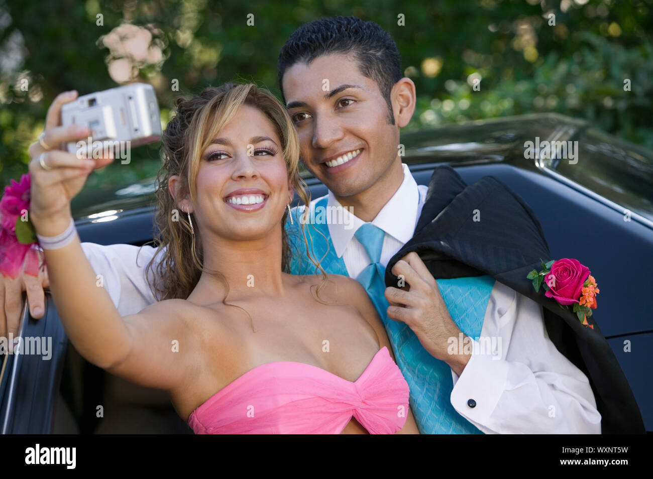 Teenage Girl Snapping Photo at Prom Stock Photo
