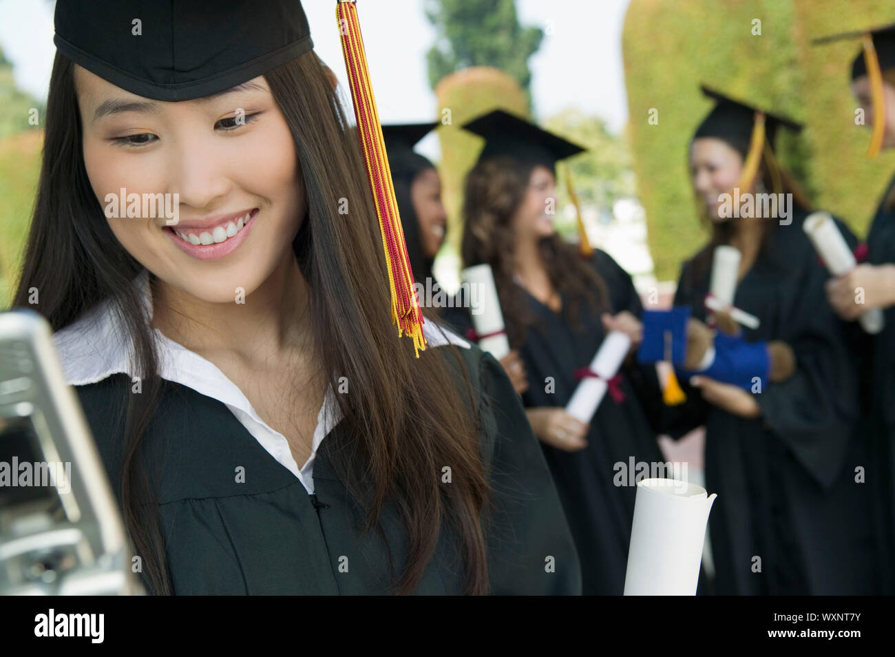 Graduation commencement phone hi-res stock photography and images - Alamy