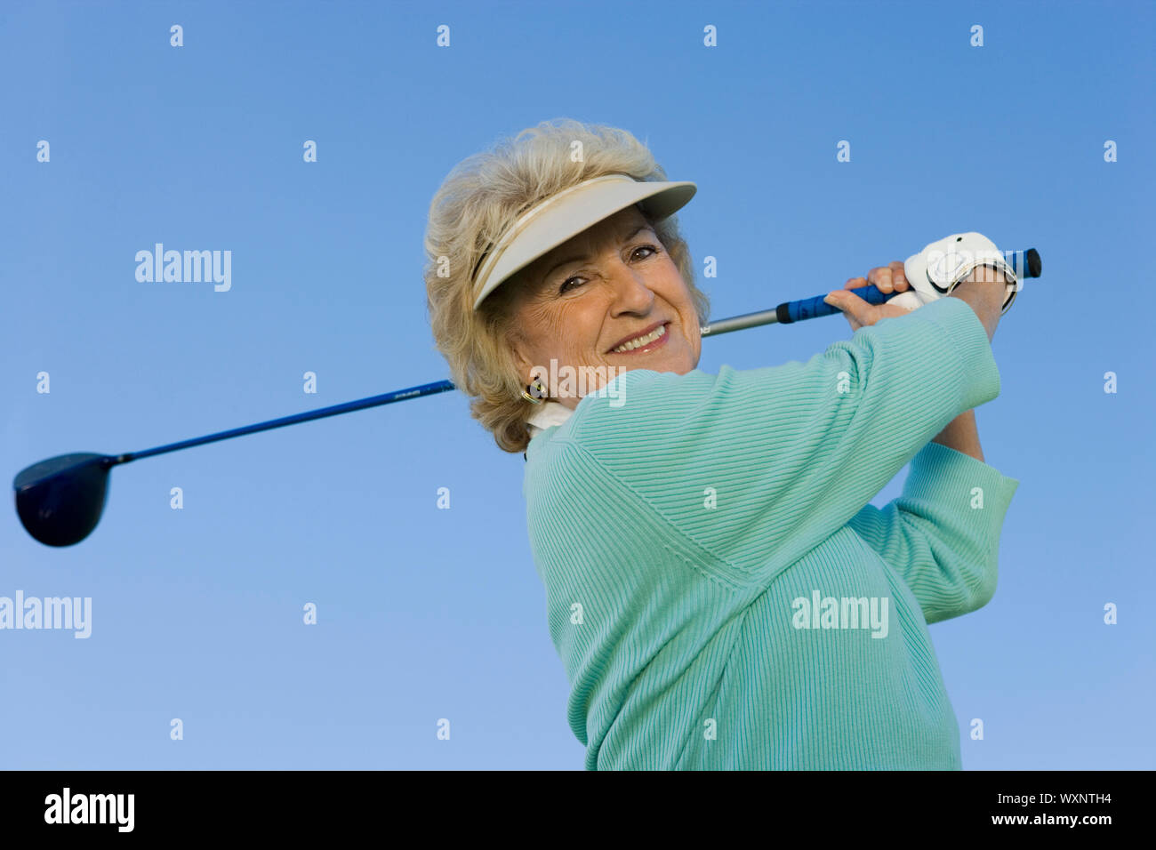 Older woman swinging hi-res stock photography and images - Alamy