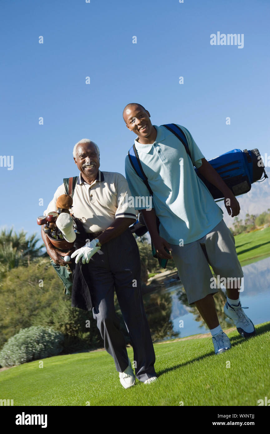 Senior Golfer and Grandson Stock Photo