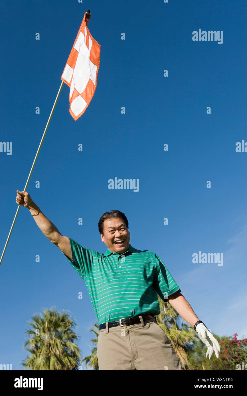 Golfer Waving Golf Flag Stock Photo Alamy