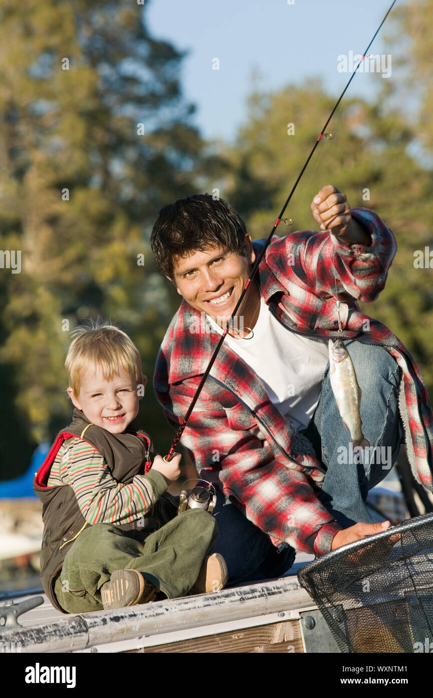 Father and Son Catching Fish Stock Photo