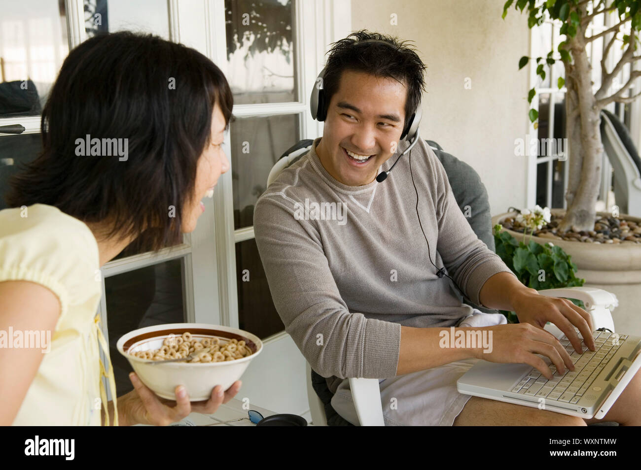 Couple Relaxing on Porch Stock Photo