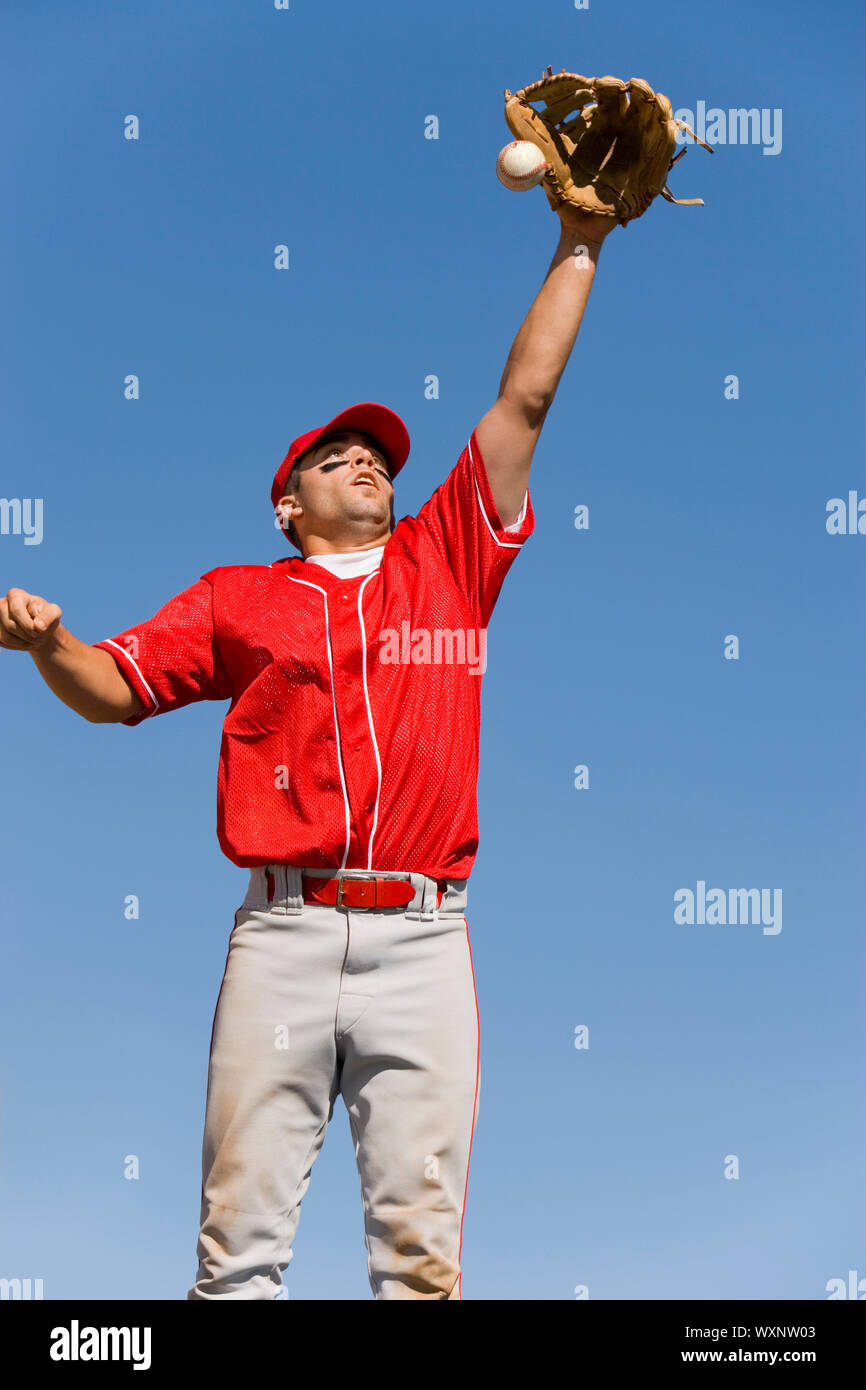 Boy jumping catch baseball hires stock photography and images Alamy