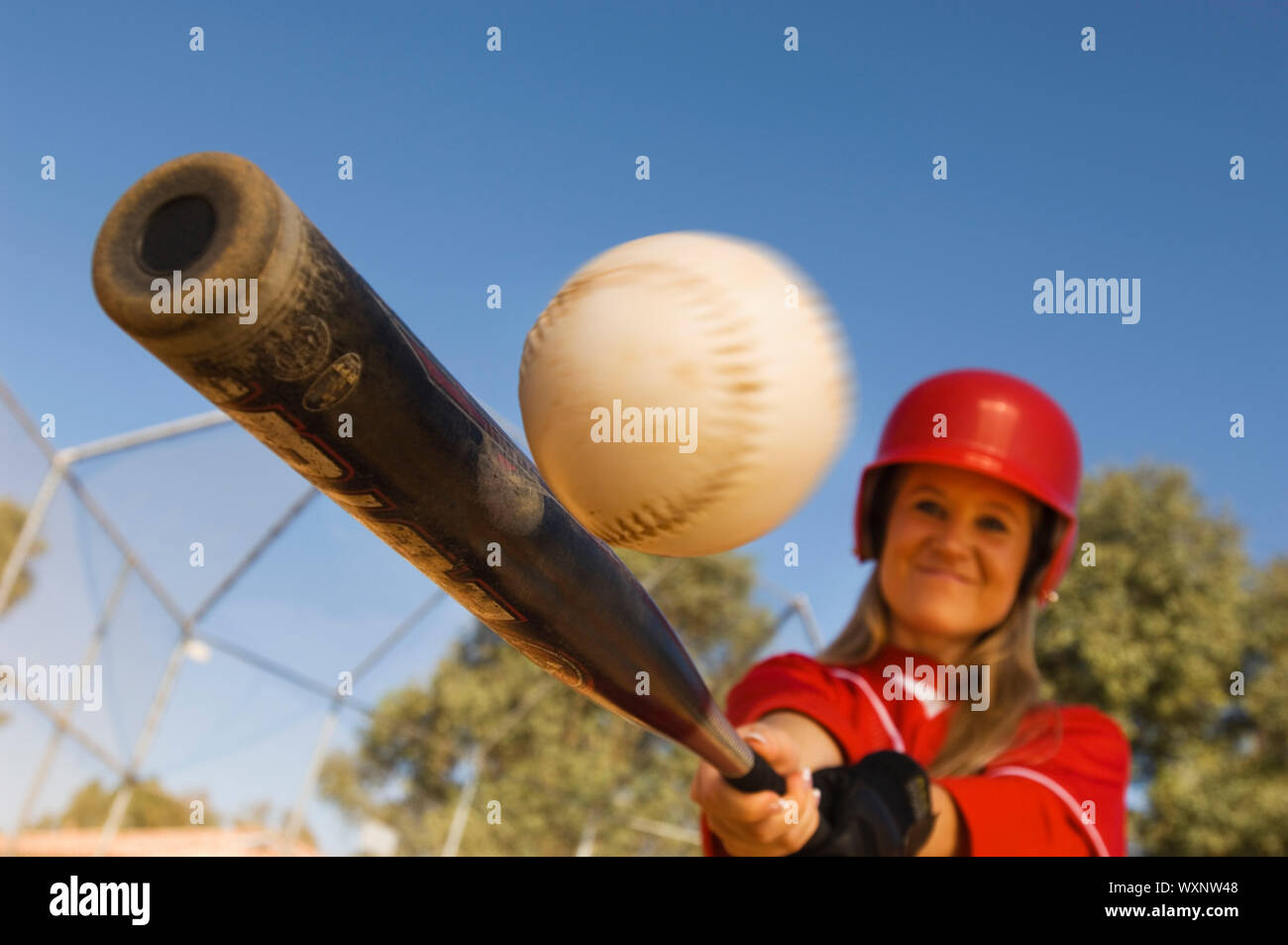 Batter Hitting Softball Stock Photo Alamy