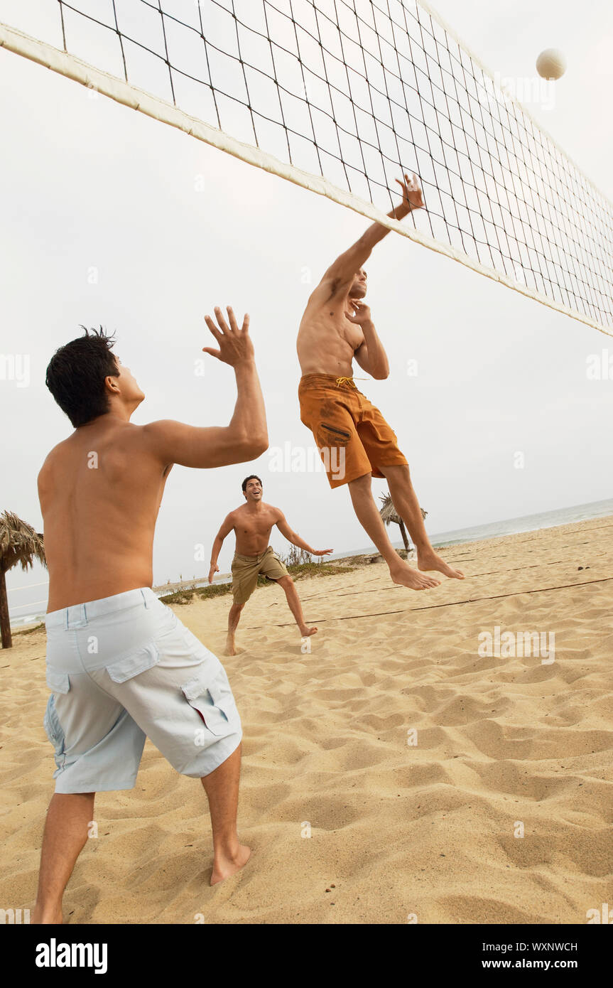 Man in Midair Going for Volleyball Stock Photo Alamy