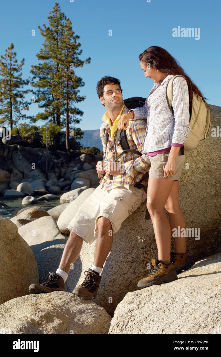 Woman resting on rocky stone hi-res stock photography and images - Alamy