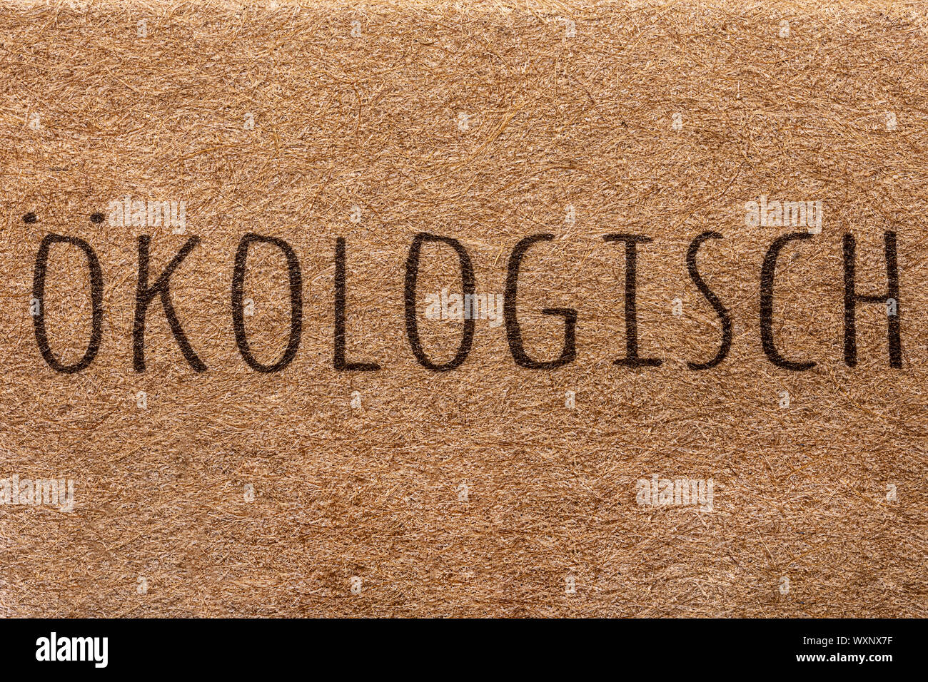 text 'ökologisch' written on natural bamboo background, translated: ecological Stock Photo