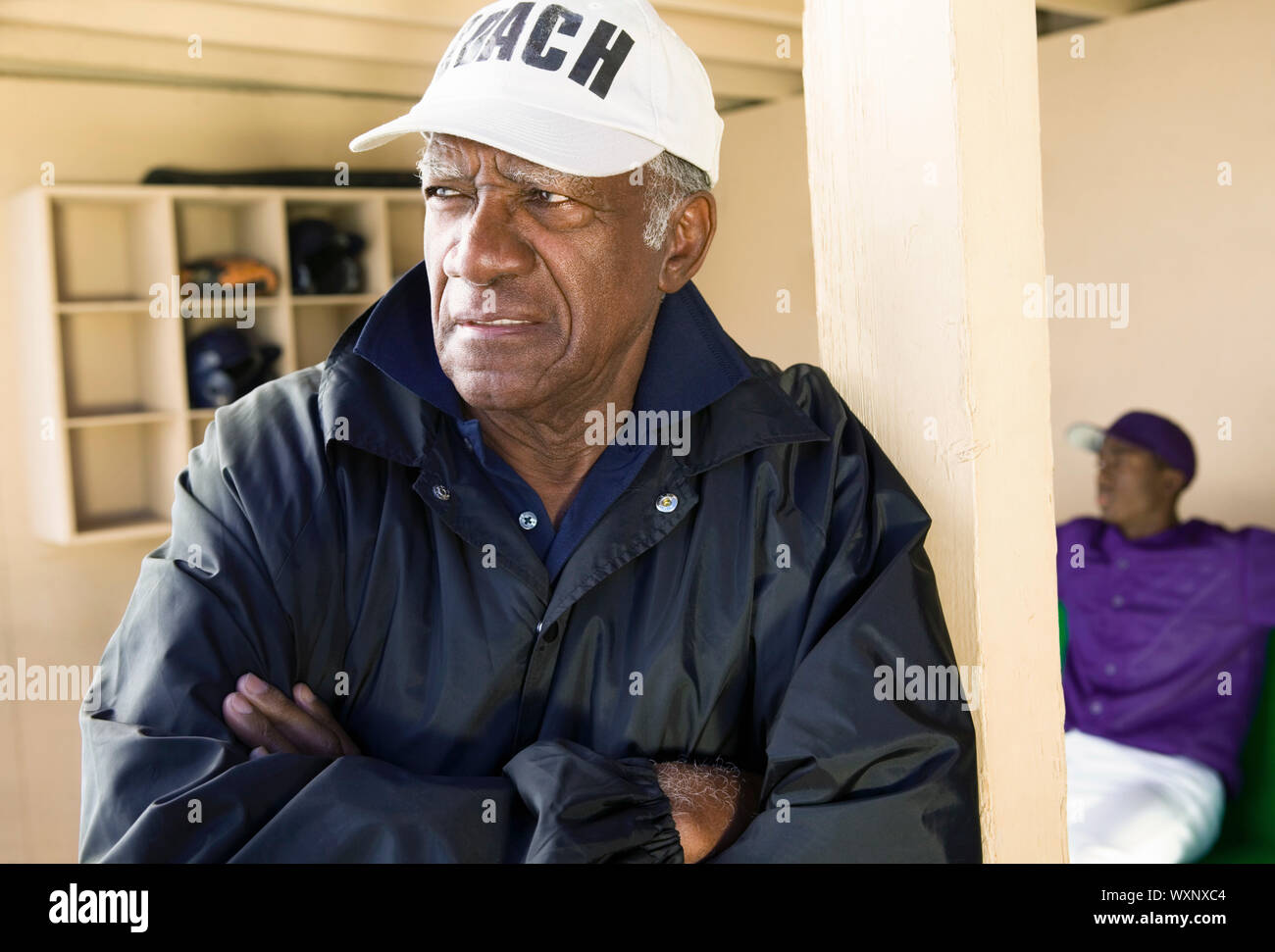 Baseball Coach Standing in Dugout Stock Photo Alamy