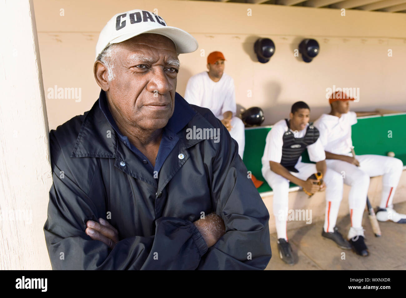Baseball Coach Watching From Dugout Stock Photo Alamy