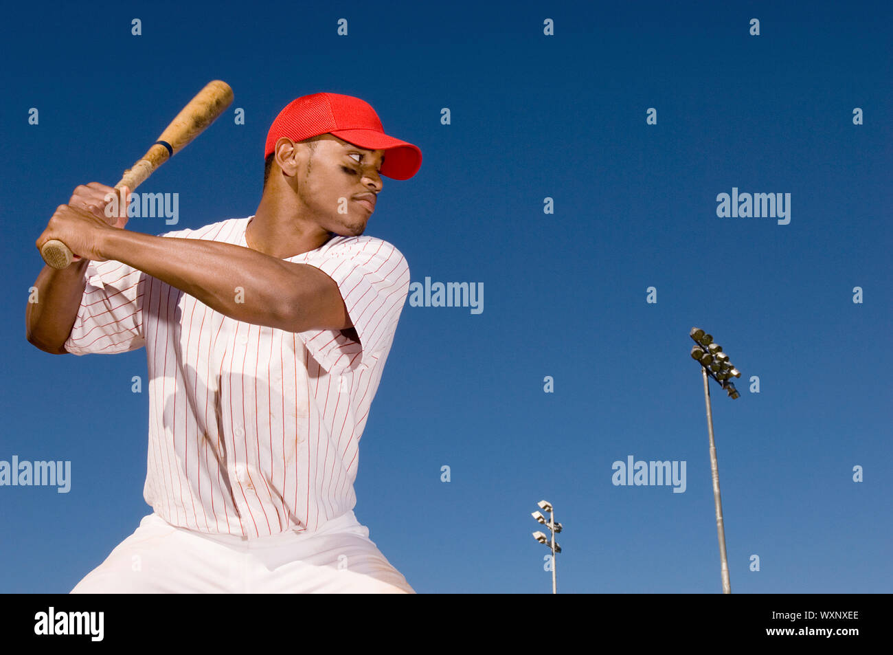 Baseball Batter Preparing to Hit Ball Stock Photo