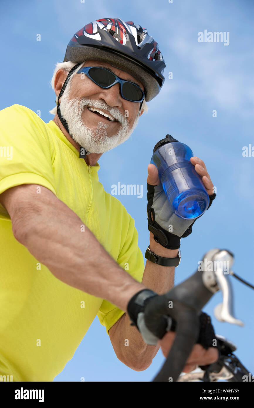 Man Refreshing After a Bicycle Ride Stock Photo - Alamy