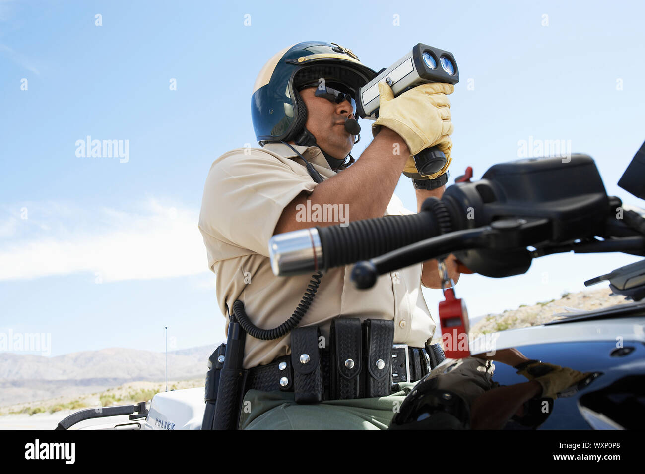Police Officer Holding Radar Gun Stock Photo Alamy