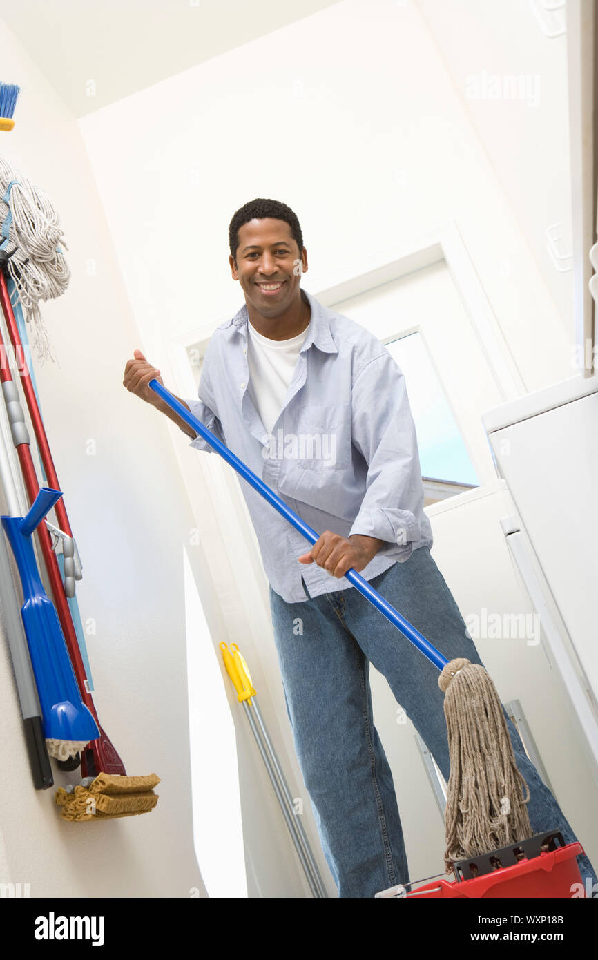 Man mopping floor Stock Photo Alamy