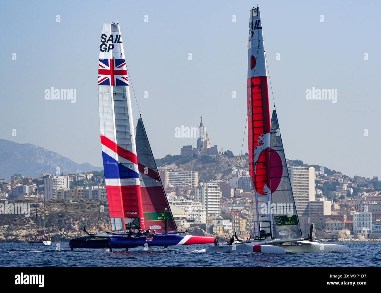 Great Britain SailGP Team helmed by Dylan Fletcher and Japan SailGP Team helmed by Nathan Outteridge in action on the Rade de Marseille as they practise for the final SailGP event of Season 1 in Marseille. Stock Photo