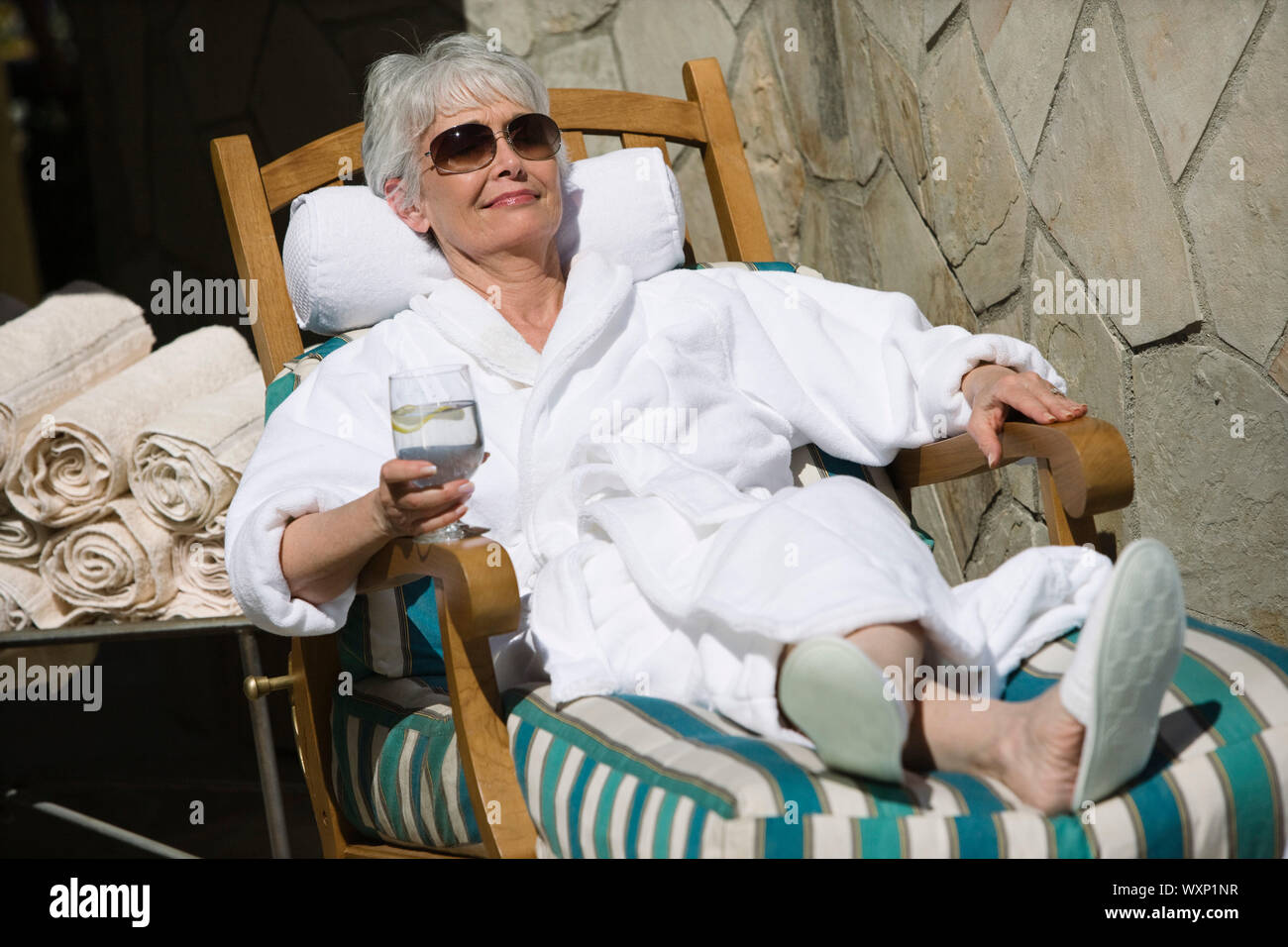 Senior woman resting feet hi-res stock photography and images - Alamy