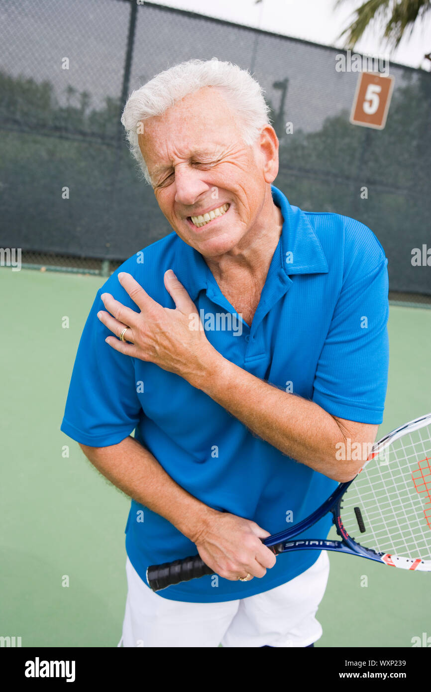 Tennis player suffering from shoulder injury Stock Photo Alamy