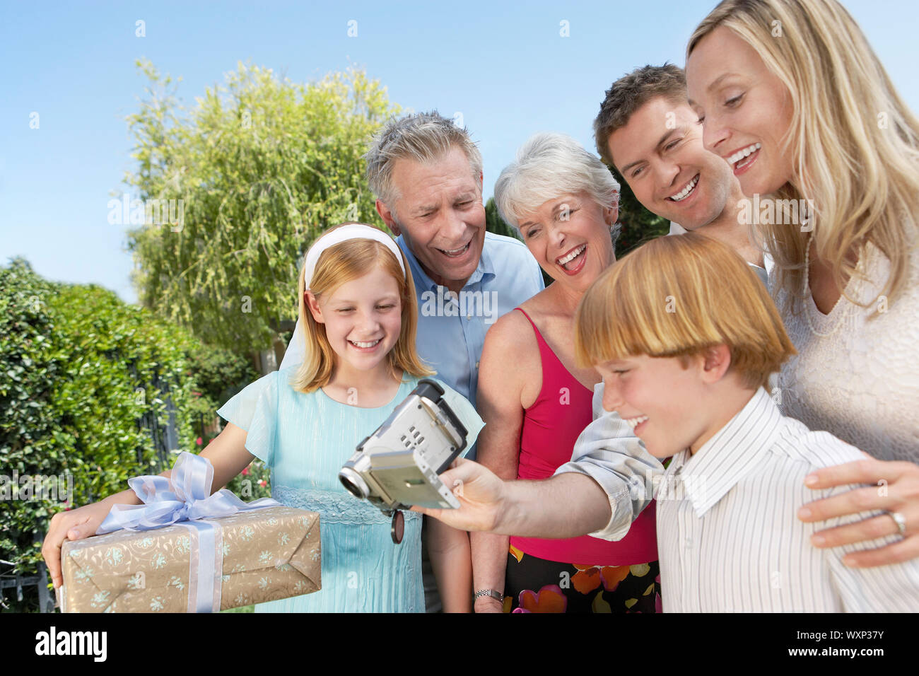 Family Using Filming Camera Family Filming a Celebration Stock Photo - Alamy