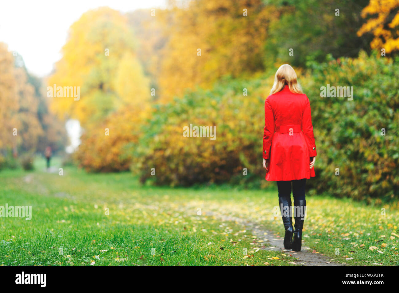 Woman coat walking rear view blond hi-res stock photography and images ...