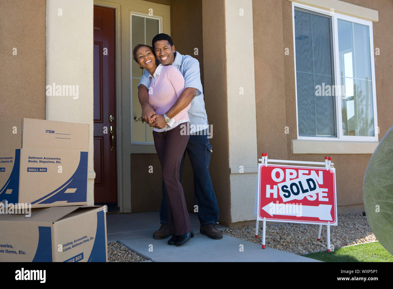 Couple moving into new house Stock Photo - Alamy