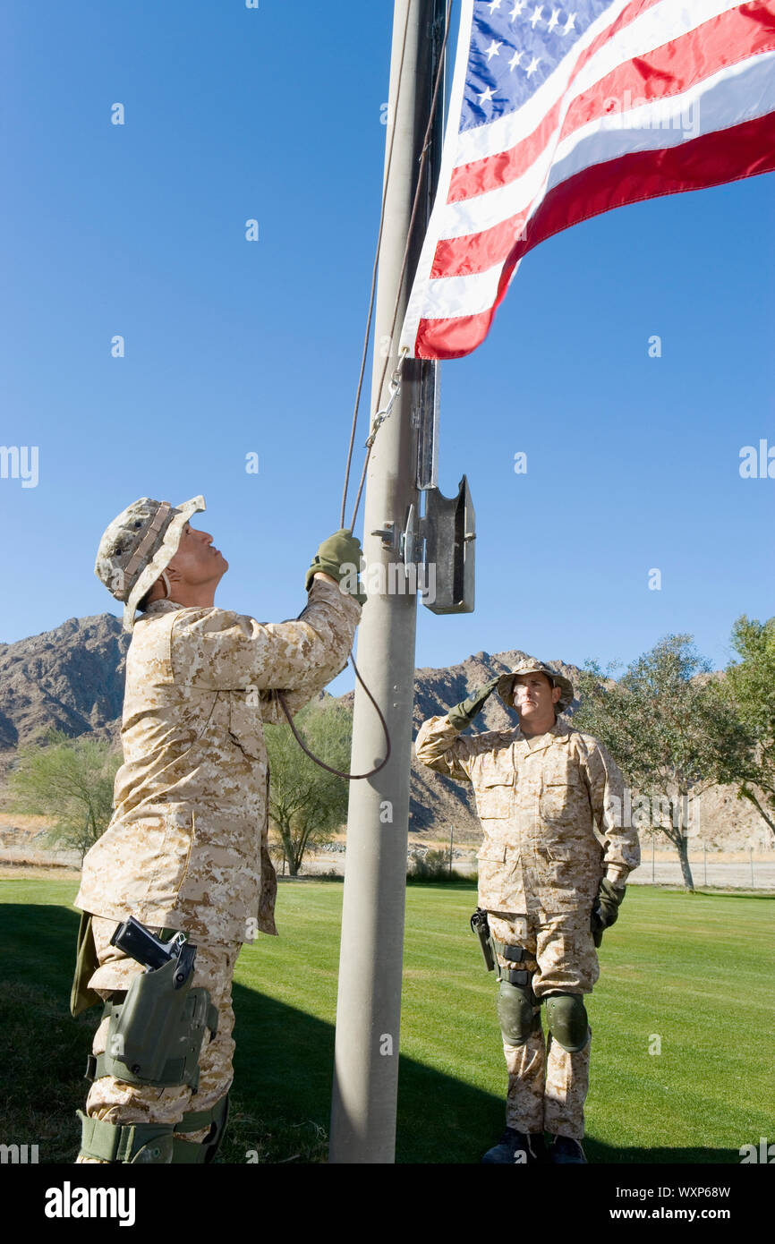 Soldiers Raising Flag Stock Photo Alamy