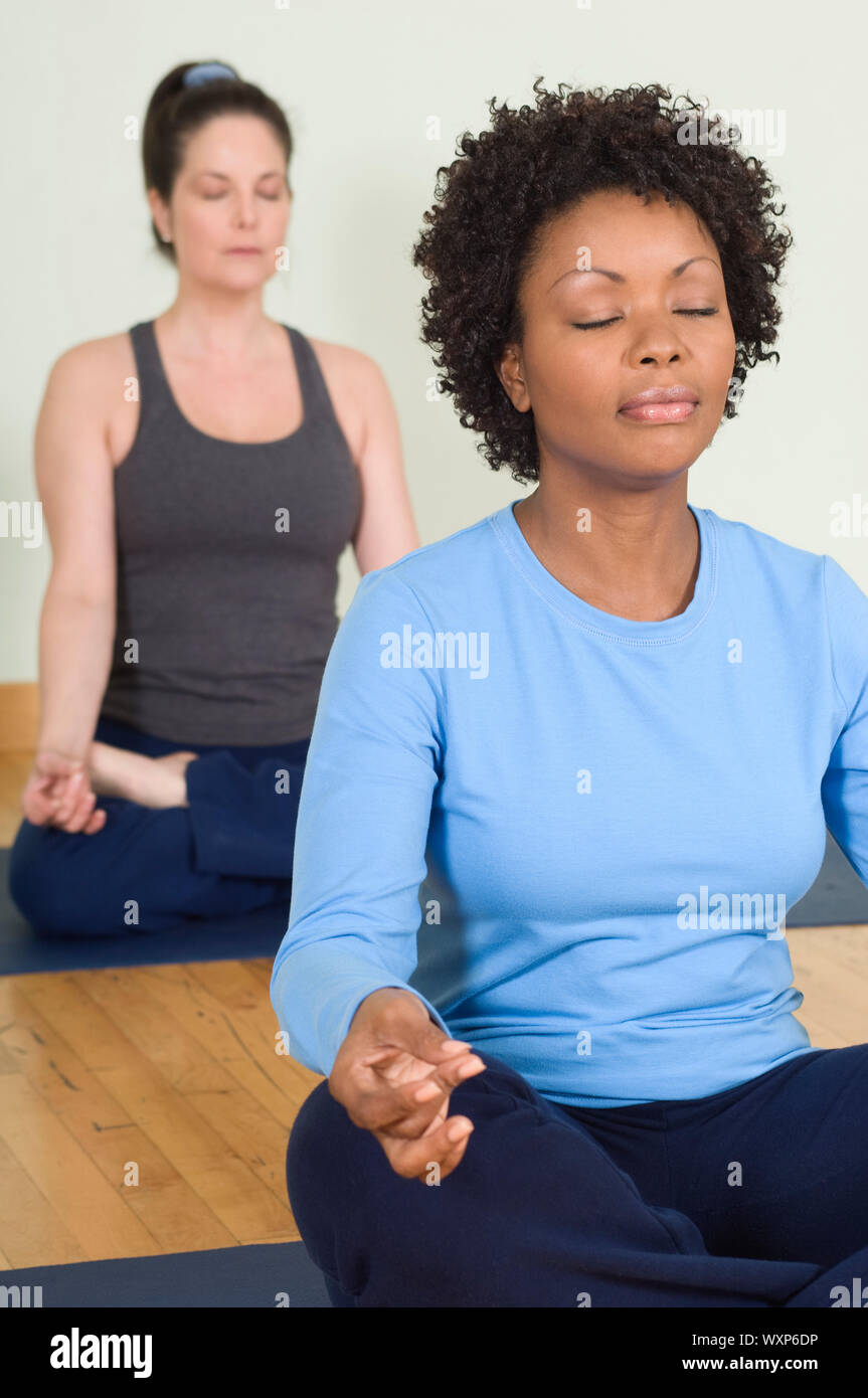 Women Meditating in Yoga Class Stock Photo Alamy