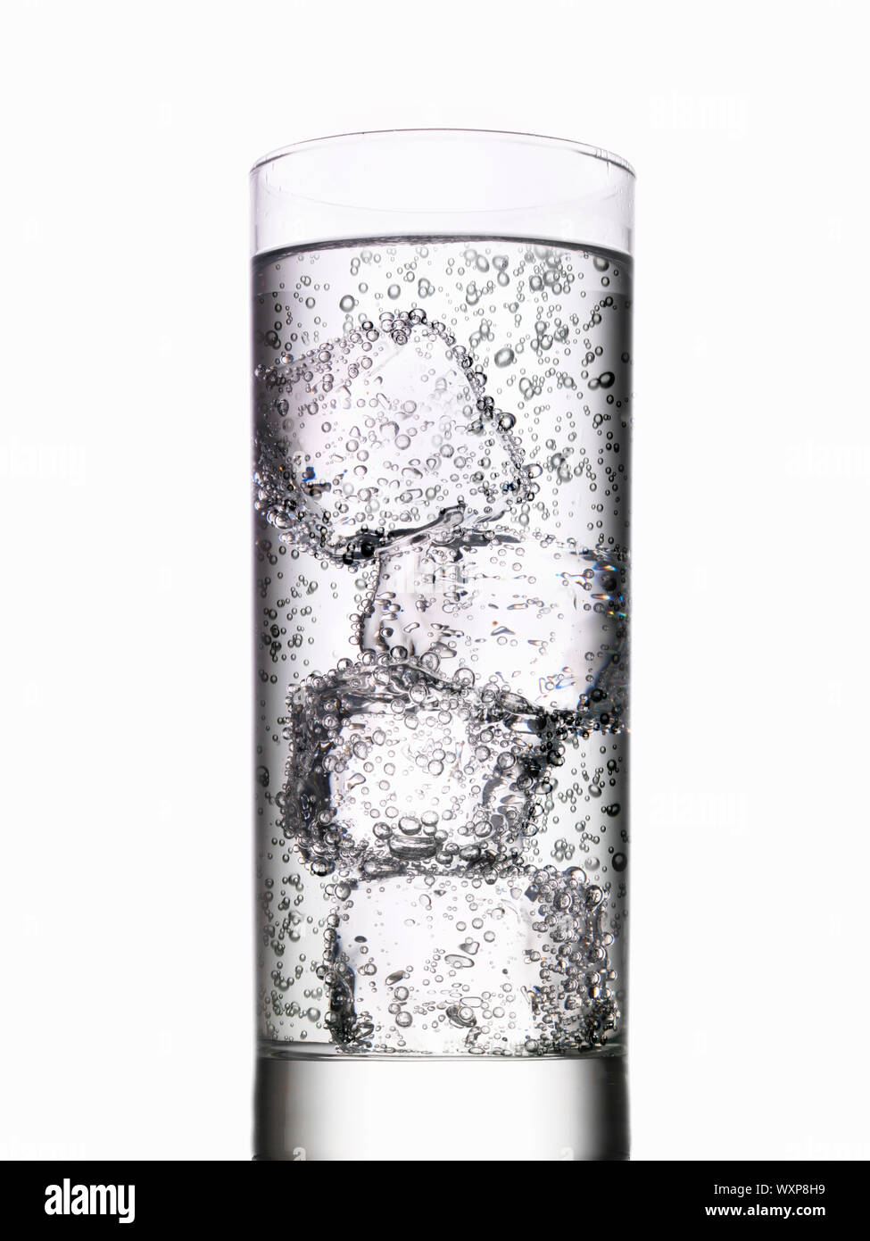 Glass of water with ice cubes on white background Stock Photo - Alamy