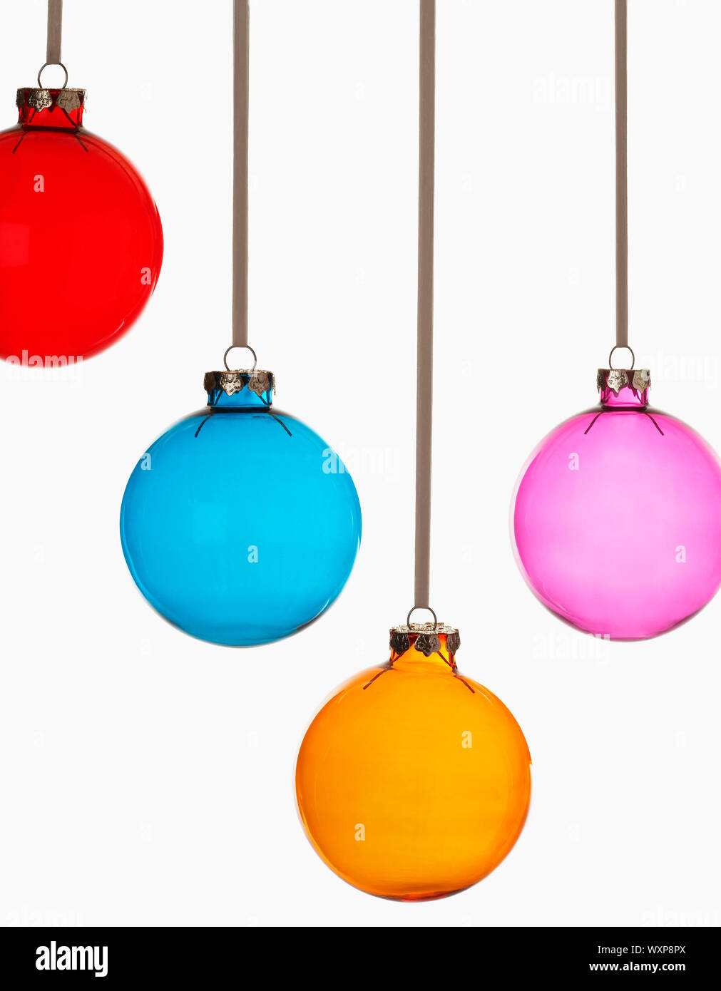 Four Christmas baubles on white background Stock Photo - Alamy