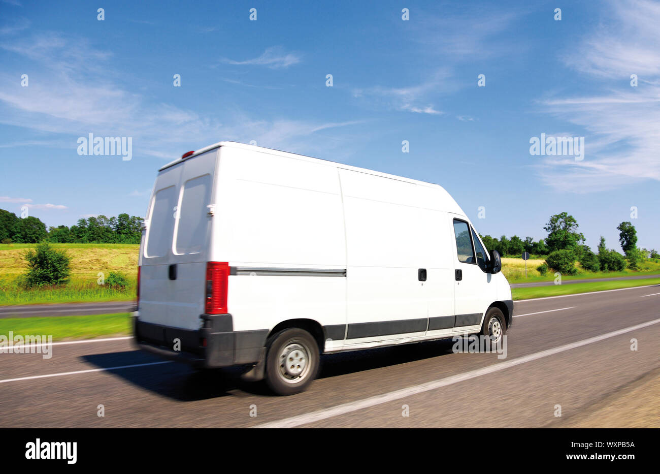 White delivery mini truck on highway Stock Photo