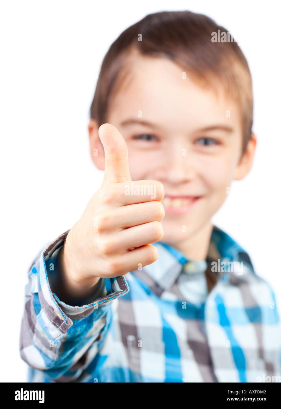 Portrait of cute boy showing thumb up on white background Stock Photo ...