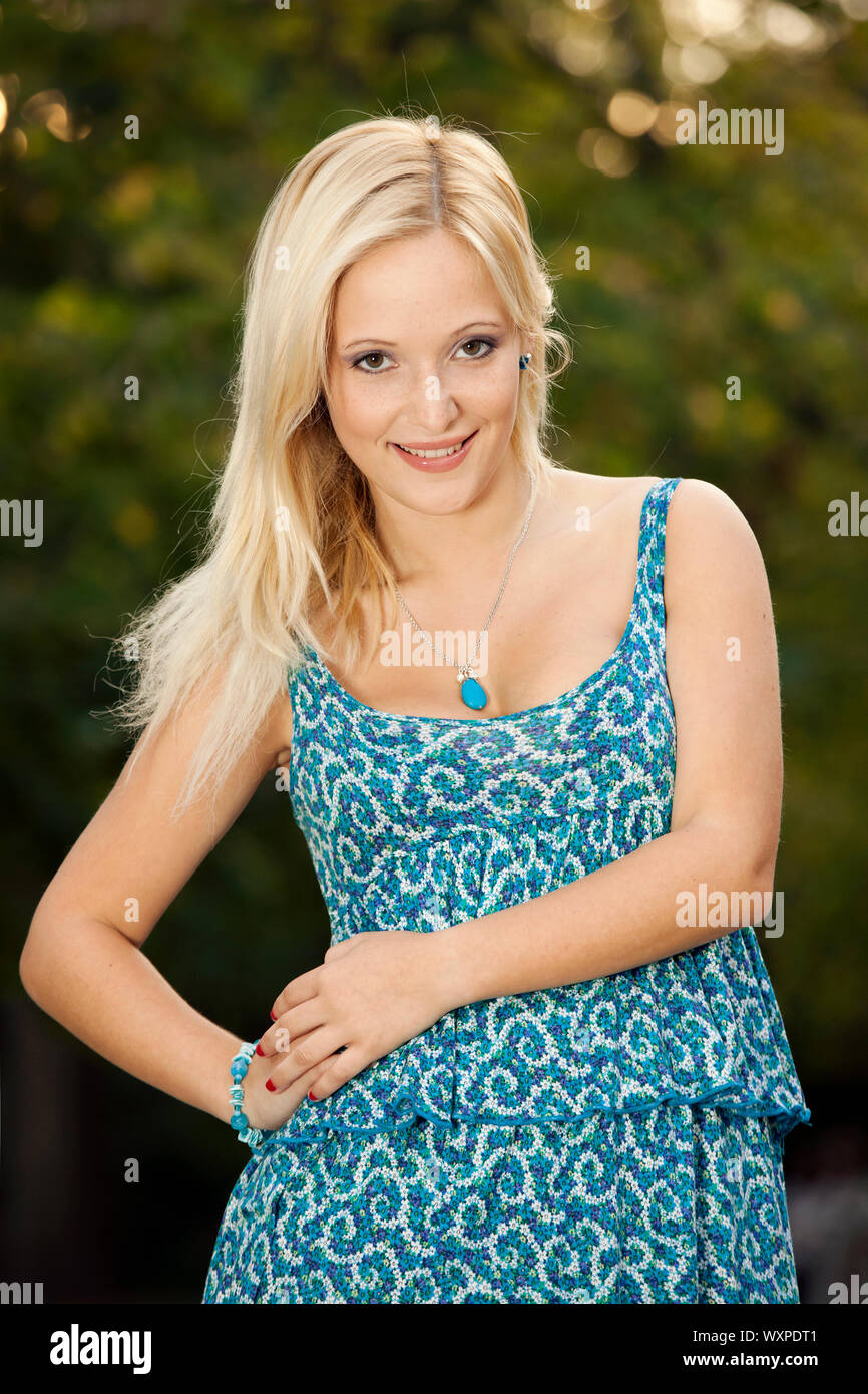 Outdoor portrait of a beautiful young girl smiling Stock Photo - Alamy