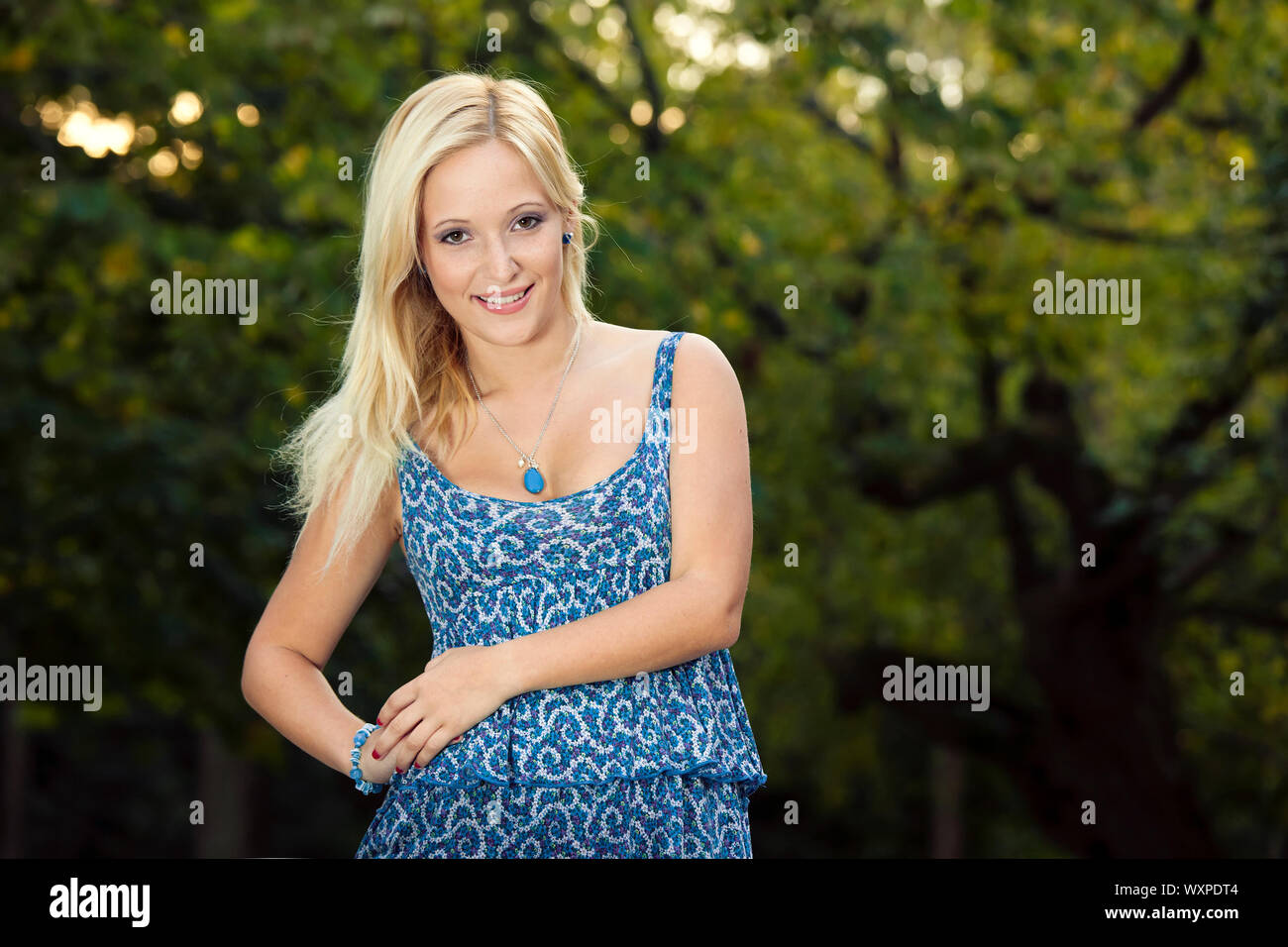 Outdoor portrait of a beautiful young girl smiling Stock Photo - Alamy