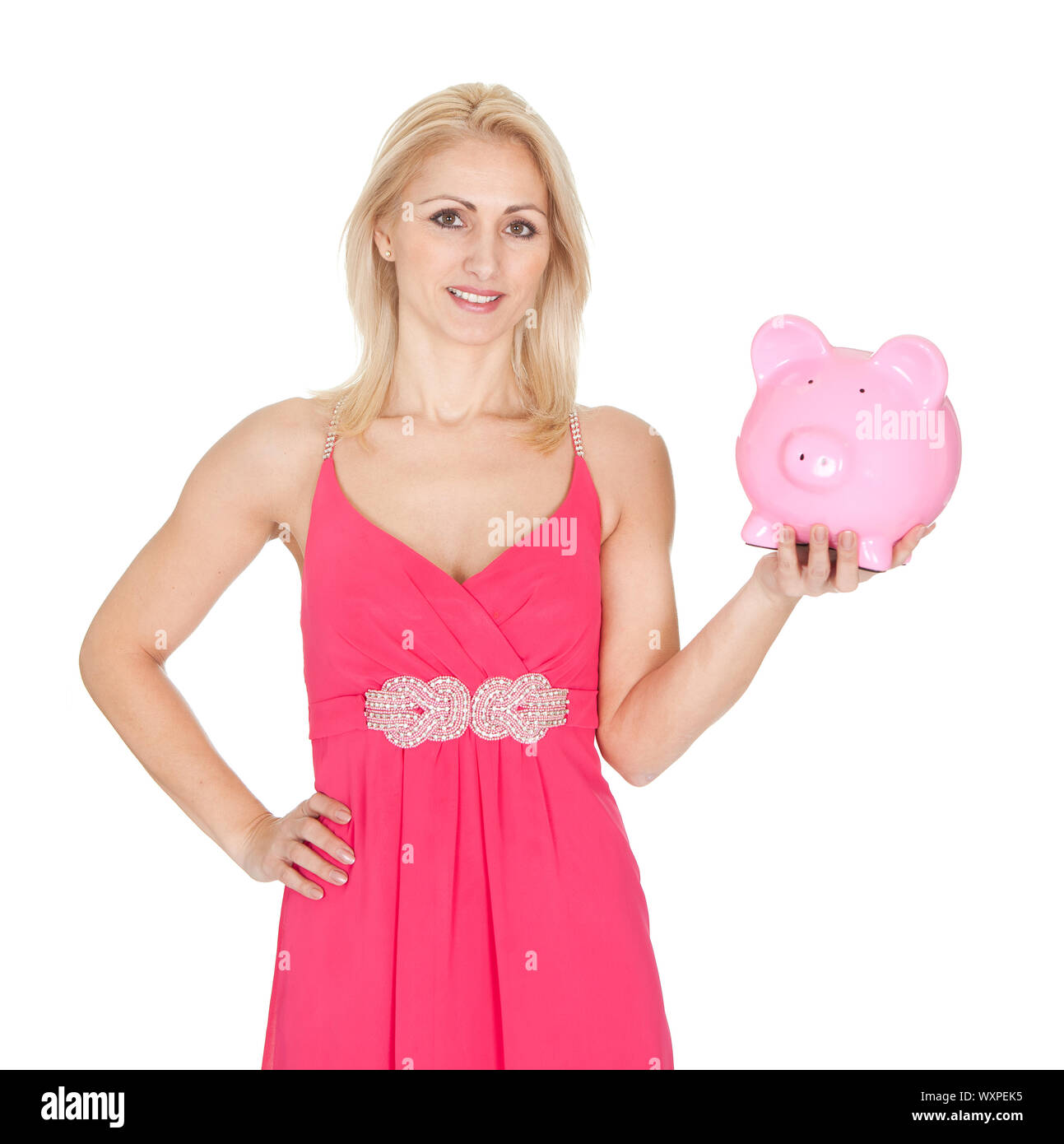 Beautiful woman holding a piggybank. Isolated on white Stock Photo - Alamy