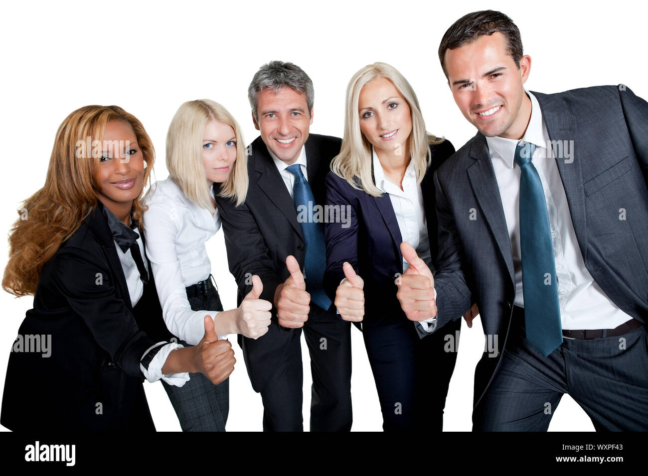 Happy business team celebrating a success with thumbs up on white ...