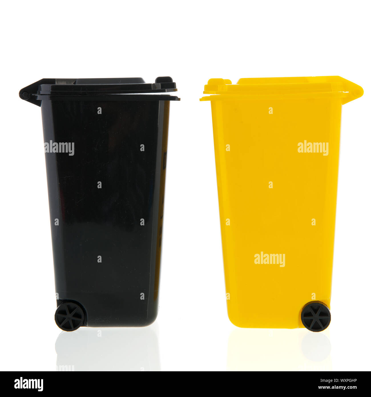 Black and yellow waste bin isolated over white background Stock Photo