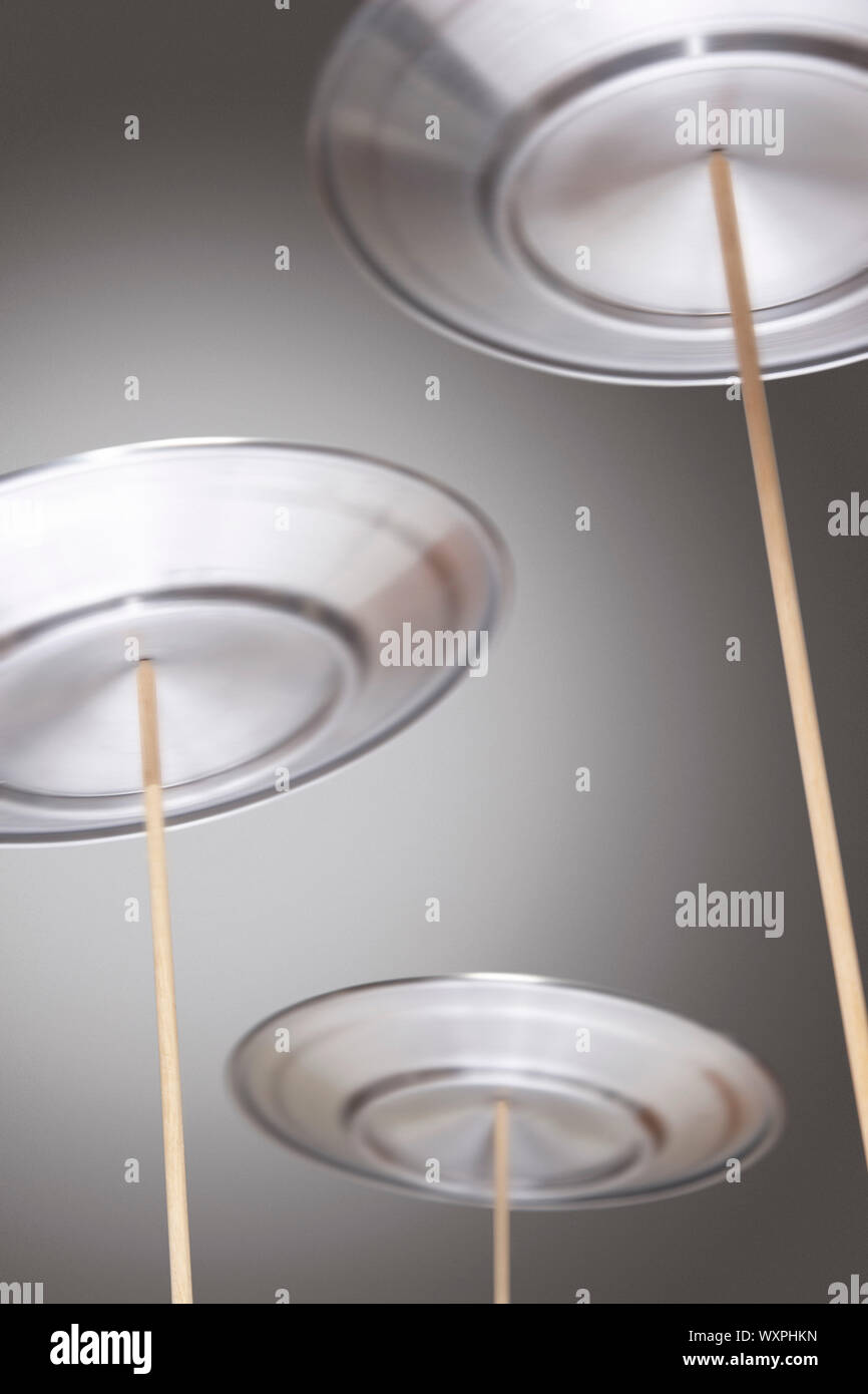 Plates Spinning on Sticks Stock Photo Alamy
