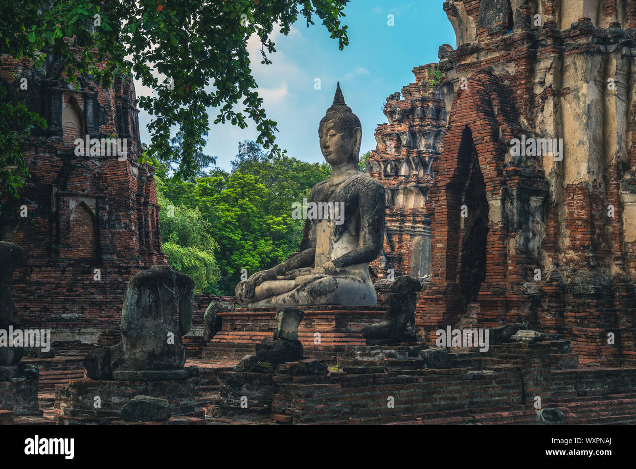 Prang and Buddha statue, Wat Mahathat, Ayutthaya, thailand Stock Photo